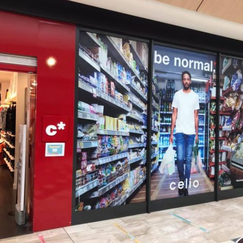 Pose adhésif sur façade magasin CELIO